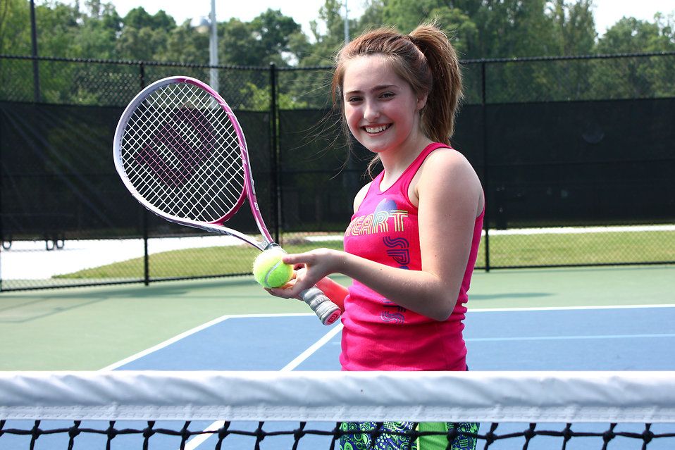 14678-a-cute-young-girl-playing-tennis-pv